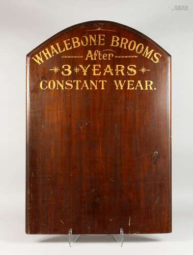 A STAINED WOOD ADVERTISING BOARD, with gilt lettering: 