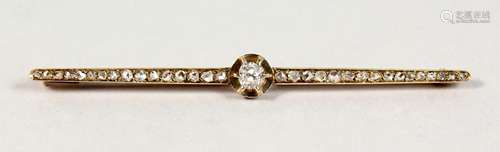 A GOLD DIAMOND SET BAR BROOCH.