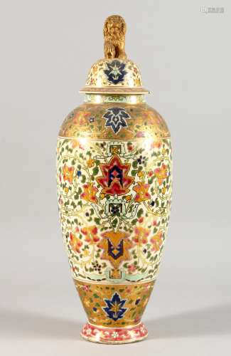A HUNGARIAN PORCELAIN VASE AND COVER, in the Oriental/Islamic taste. 17ins high.