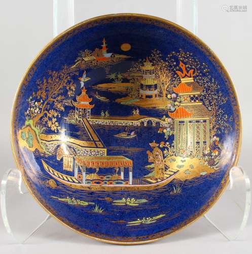 A CARLTON WARE BLUE GROUND DECORATED CIRCULAR BOWL, painted with a Chinese scene to the interior.