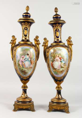 A SUPERB PAIR OF LARGE SEVRES RICH DARK BLUE GROUND VASES AND COVERS, with ormolu mounts,