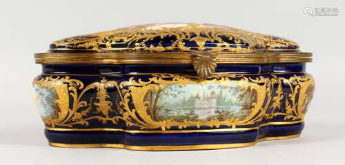 A SUPERB CONTINENTAL SHAPED CASKET AND COVER, rich dark blue ground with gold decoration, the lid