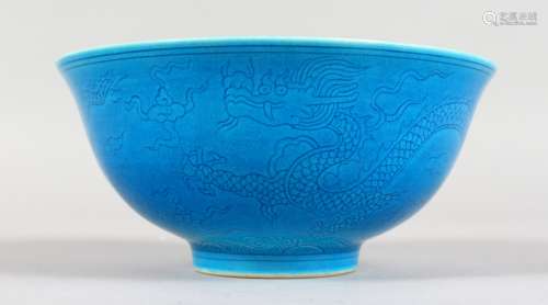 A CHINESE BLUE GROUND CIRCULAR BOWL, the sides etched with dragons. Six character mark. 6ins
