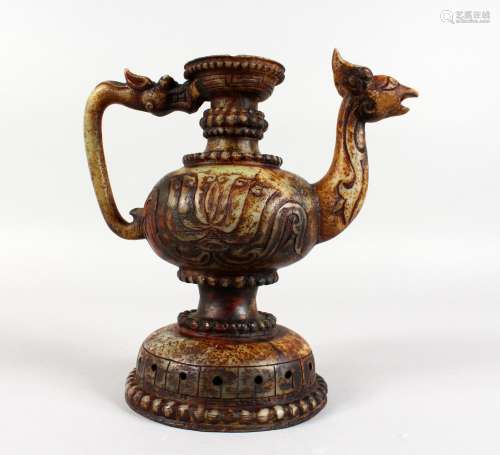 A CHINESE RUSSET JADE JUG with grotesque handle and spout. 9ins high.