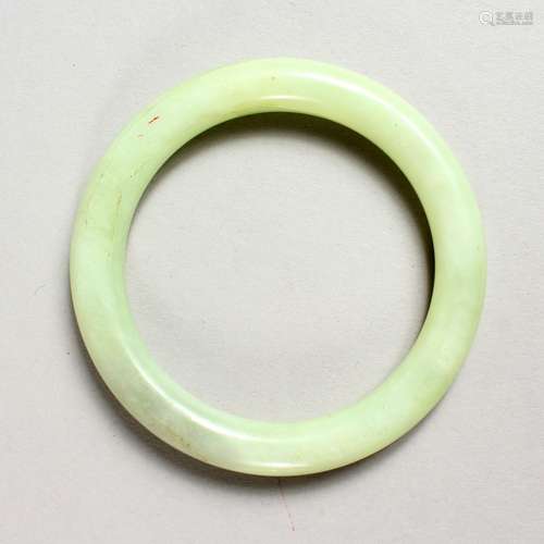 A PALE JADE BANGLE.