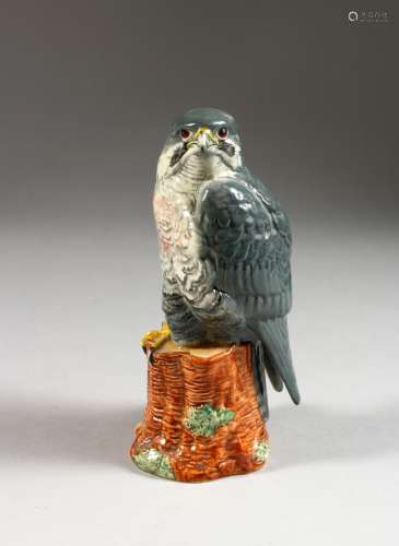 A PEREGRINE FALCON PORCELAIN FIGURE FOR BENEAGLES WHISKY, 200ml. 7ins high.