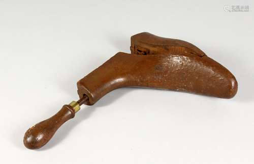 A 19TH CENTURY WOODEN BOOT TREE, with turned handle. 8.5ins long.