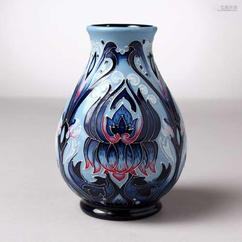 A MOORCROFT POTTERY BLUE VASE. Signed Paula Hitchcock, No. 9/150, 2010. 5.5ins high.