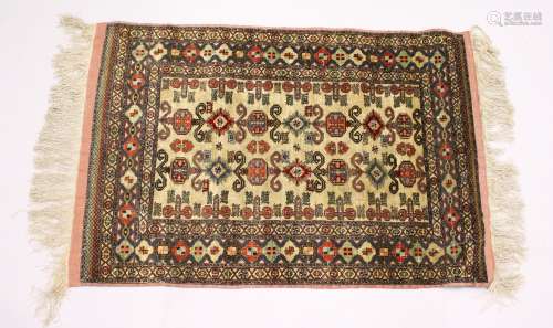 A NORTH EAST PERSIAN SARKHAS SILK RUG, beige ground with Caucasian Perdidil design. 5ft 9ins x 3ft