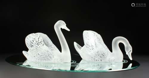 A SUPERB LALIQUE SWAN TABLE CENTREPIECE formed as two swans, 14ins long, standing on a large oval