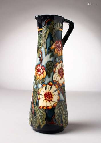 A MOORCROFT POTTERY TALL JUG. Signed K. Goodman. No. 355/400. 9.5ins high.