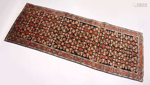 A PERSIAN MAHAL HALL CARPET, dark blue ground, with floral decoration, in a similar red ground