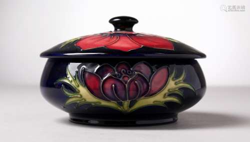 A MOORCROFT POTTERY CIRCULAR POWDER BOWL AND COVER, 34194. 5ins diameter.