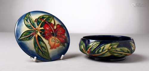 A MOORCROFT POTTERY CIRCULAR POWDER BOWL AND COVER, 99. 6ins diameter.