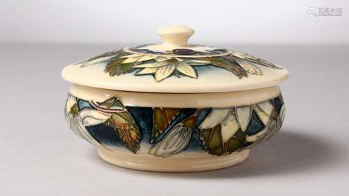 A MOORCROFT POTTERY CIRCULAR POWDER BOWL AND COVER, 2000. 5ins diameter.