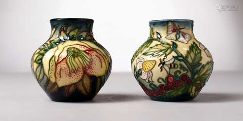 TWO SMALL MOORCROFT POTTERY BULBOUS VASES. 3.5ins high.