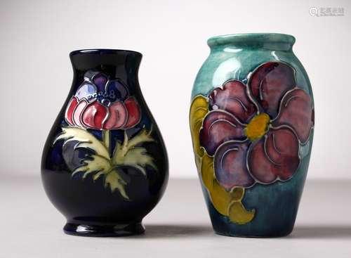 TWO SMALL MOORCROFT POTTERY VASES. 4ins and 4.5ins high.