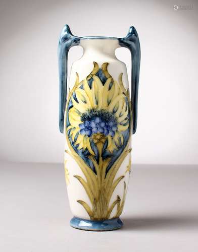 A MOORCROFT TWO-HANDLED POTTERY VASE. Mark WM 55. 8ins high.