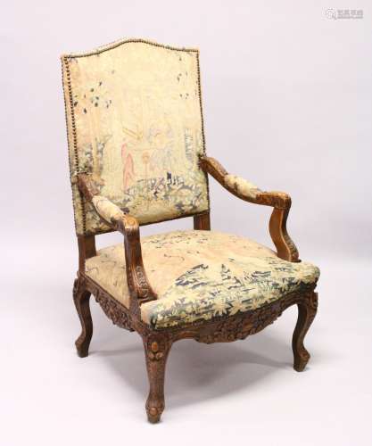 A GOOD 19TH CENTURY CARVED WALNUT FRAMED ARMCHAIR, with tapestry upholstery.