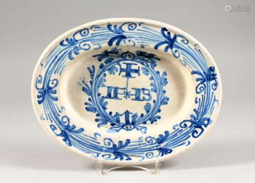 A CONTINENTAL OVAL MARRIAGE DISH, painted and initialled in blue. 11.5ins wide.
