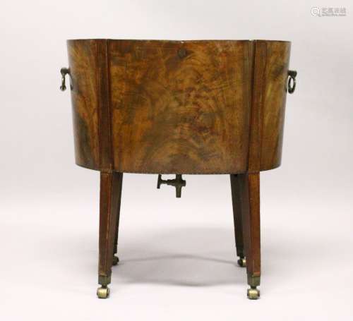 A GEORGE III MAHOGANY OVAL WINE COOLER, with brass handles, tapering square legs with brass castors.