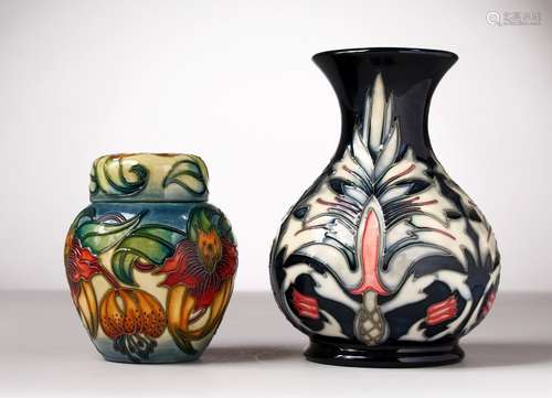 A MOORCROFT POTTERY VASE and A GINGER JAR AND COVER. 6.5ins and 4.5ins high.