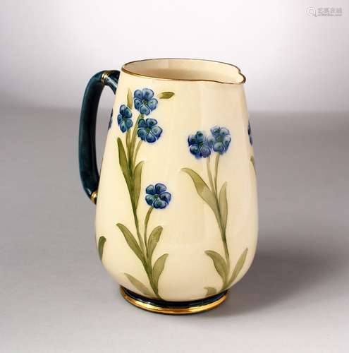 A MOORCROFT POTTERY MACINTYRE JUG. Made for JONES & HIGGIN, PECKHAM, No. 2830, cream ground with