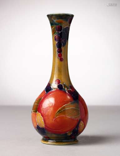 A MOORCROFT POTTERY BULBOUS VASE, blue ground with pomegranates and fruit. Impressed MOORCROFT, W.