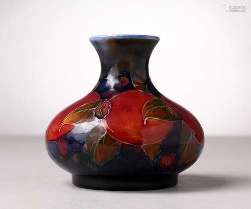 A MOORCROFT POTTERY BULBOUS VASE, blue ground with pomegranates and fruit. Impressed MOORCROFT, W.