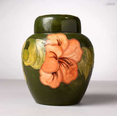 A GOOD MOORCROFT POTTERY BULBOUS GREEN GROUND GINGER JAR AND COVER, 