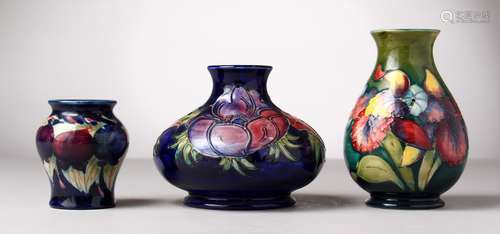 THREE VARIOUS MOORCROFT POTTERY VASES. Green initials, Impressed MOORCROFT and paper labels.