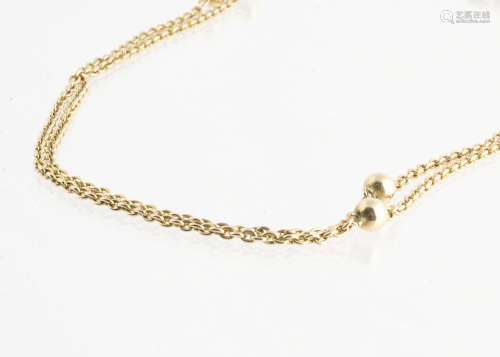 An early 20th Century oval linked opera length chain, with bead spacers and a snap clasp marked 9ct,