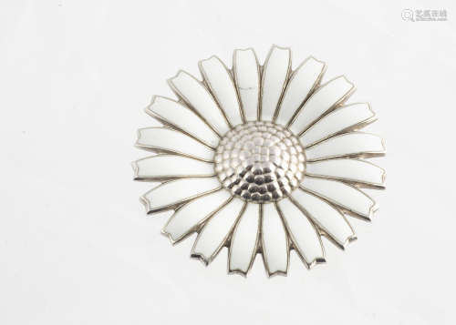 A George Jensen silver and enamel daisy brooch, with raised centre section and white enamel