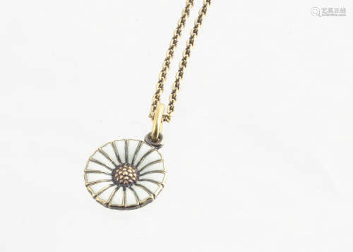 A George Jensen silver gilt and enamel daisy pendant and chain, the white enamel pendant on an