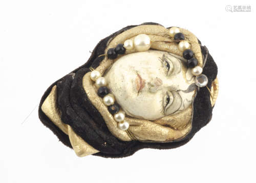 A Venetian late 20th Century mixed media brooch, modelled as a young female face, within a leather