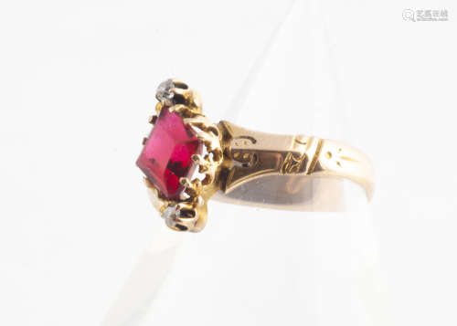 A continental red paste and diamond claw set ring, the central red triangular paste stone in claw