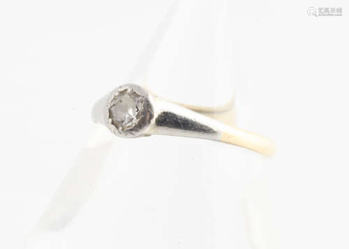 An 18ct gold and platinum set diamond solitaire, ring size M, 2.5g