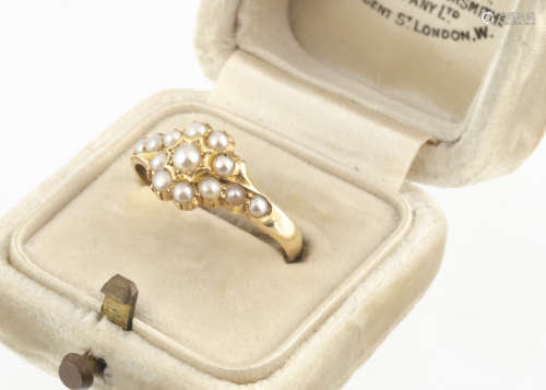A Victorian 18ct gold seed pearl cluster ring, with half cut pearls on a yellow gold shank,