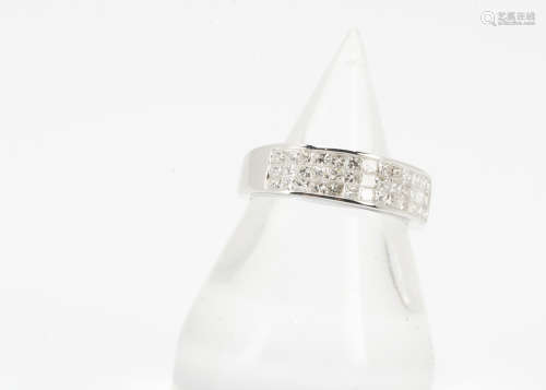 An 18ct white gold diamond half hoop eternity ring, the three bands of princess cut in sunken