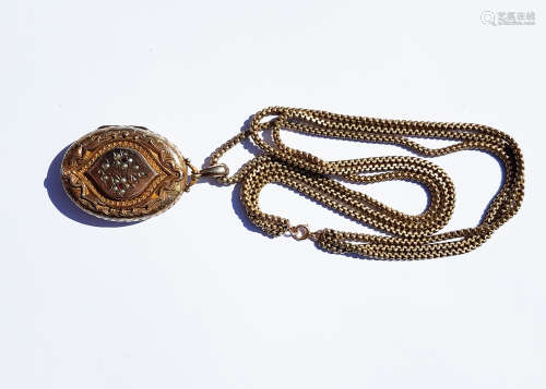 A Victorian pinchbeck oval locket, with a floral design of red paste stones and seed pearls on a