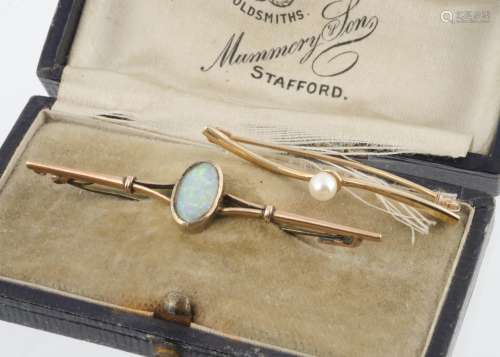 An Edwardian yellow metal and precious opal bar brooch, marked 9ct in a fitted leather box from