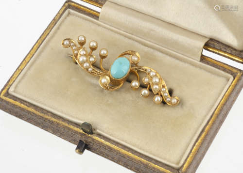 An Edwardian 15ct gold turquoise and seed pearl brooch, of scroll design marked 15ct to back, in