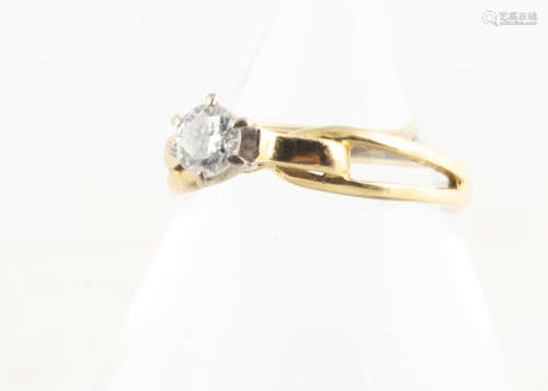 An 18ct gold diamond solitaire, the brilliant cut diamond in six claw setting on a scroll and
