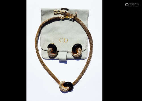 A Christian Dior necklace and earring set, black enamel and paste stones, within a pave setting,