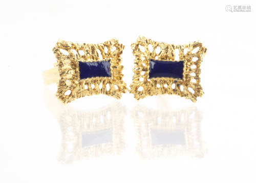 A pair of continental yellow metal and enamel snap back cufflinks, the pierced rectangular