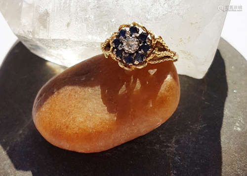 A sapphire and diamond 18ct gold contemporary dress ring, the brilliant cut diamond in claw