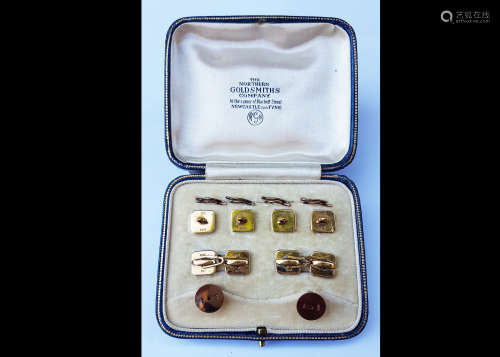 An 18ct and 9ct gold mother of pearl and seed pearl dress stud set, comprising four studs with split