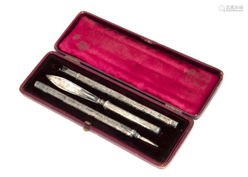 A late Victorian silver three pen set, in fitted box, with pencil, quill holder and blade (4)
