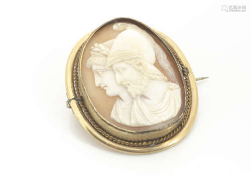 A 19th Century shell carved cameo brooch, the carving depicting a Greek warrior and his Queen, on