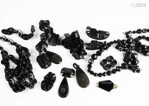 A large collection of Victorian jet jewellery, to include faceted beads, oval pendants, carved acorn